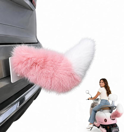 Pink and white wagging tail closeup